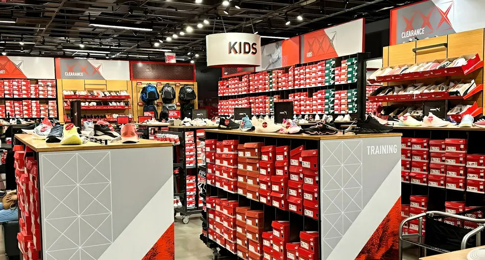 Inside view of Puma Store with various Puma apparel, shoes, and accessories