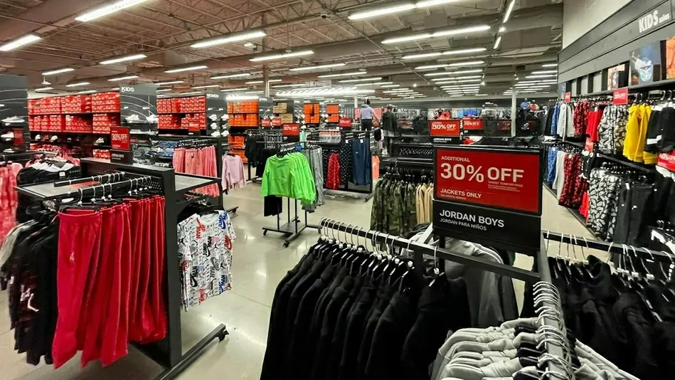 Inside view of Nike Factory Store with various Nike apparel, shoes, and accessories