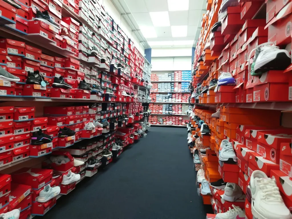 Shelves at Rack Room Shoes with various sneaker models and brands
