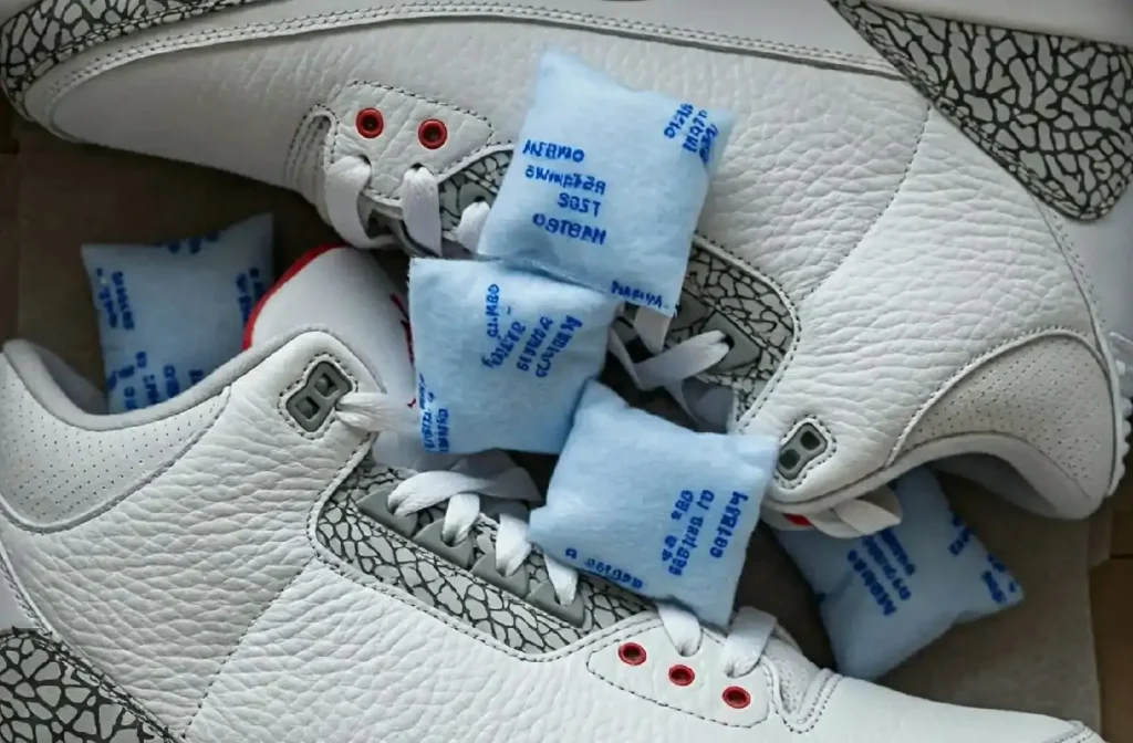 Silica gel packets inside a sneaker box to help protect against hydrolysis