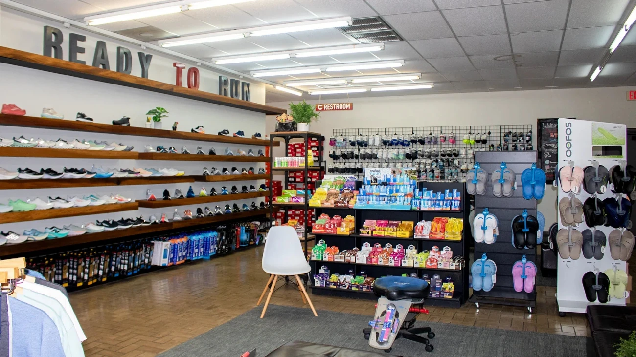 Ready to Run interior with a long running-shoe wall, accessory displays and fitting seats.