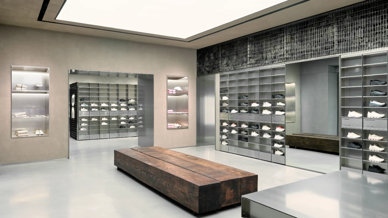 Minimalist On interior with lit shoe shelves and a wooden bench
